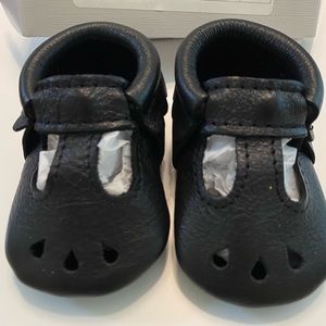 Freshly picked black Mary Jane moccasins